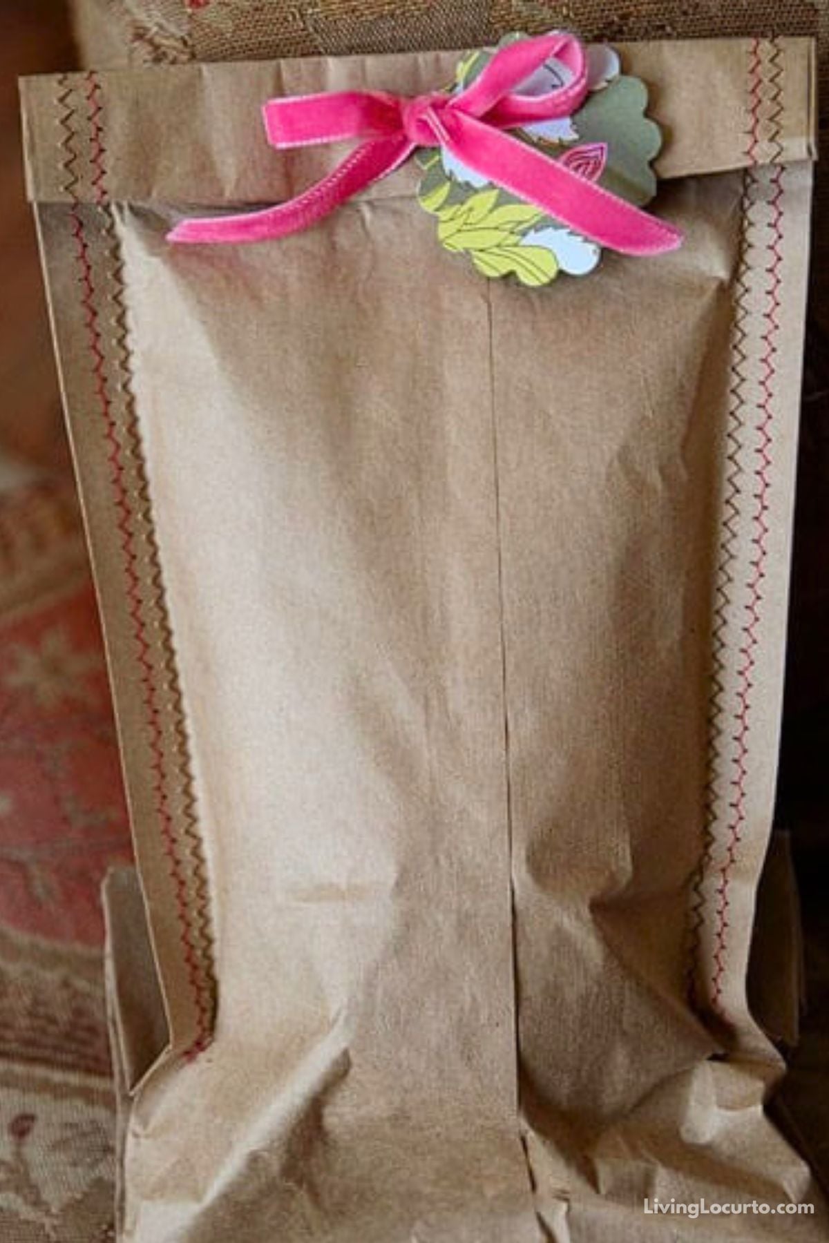 Turn an ordinary brown paper lunch bag into boutique-style gift wrap! Follow this easy DIY craft tutorial featuring a simple sewing technique, cute tags, and ribbon.