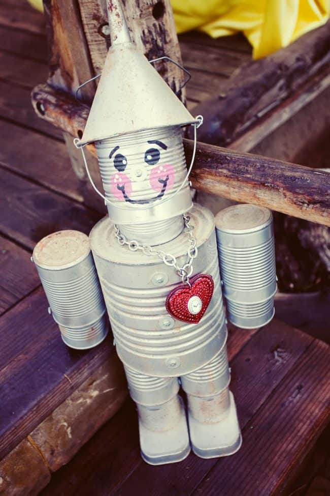 Tin Man - Creative ways to add color and joy to a garden, porch, or yard with DIY Yard Art and Garden Ideas! Repurposed ideas for the backyard. Fun ideas for flower gardens made from logs, bikes, toys, tires and other old junk. ~ featured at LivingLocurto.com