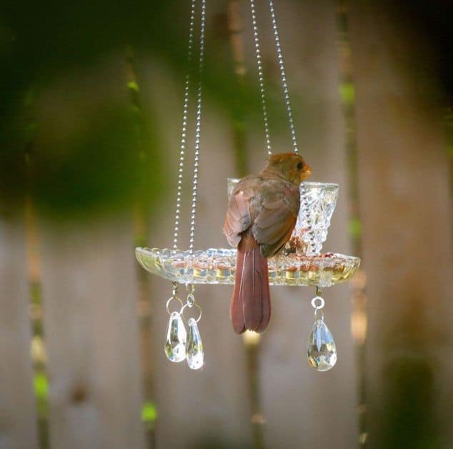 Pretty Yard Art and Garden ideas. These recycled teacup and crystal homemade bird feeders are beautiful!