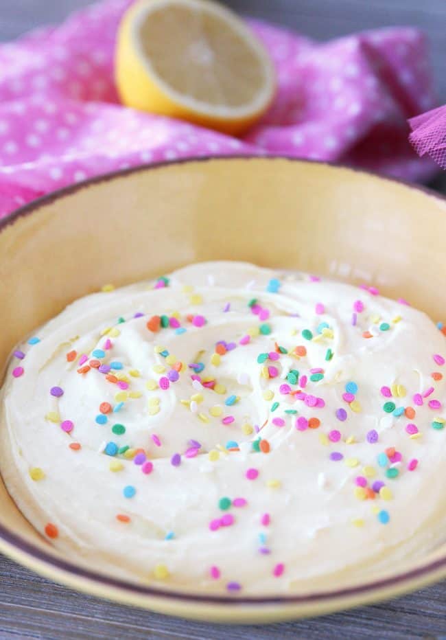 Easy Lemon Dip with only three ingredients! This healthy fruit dip recipe is as easy as pie. Add sprinkles for fun birthday party food.