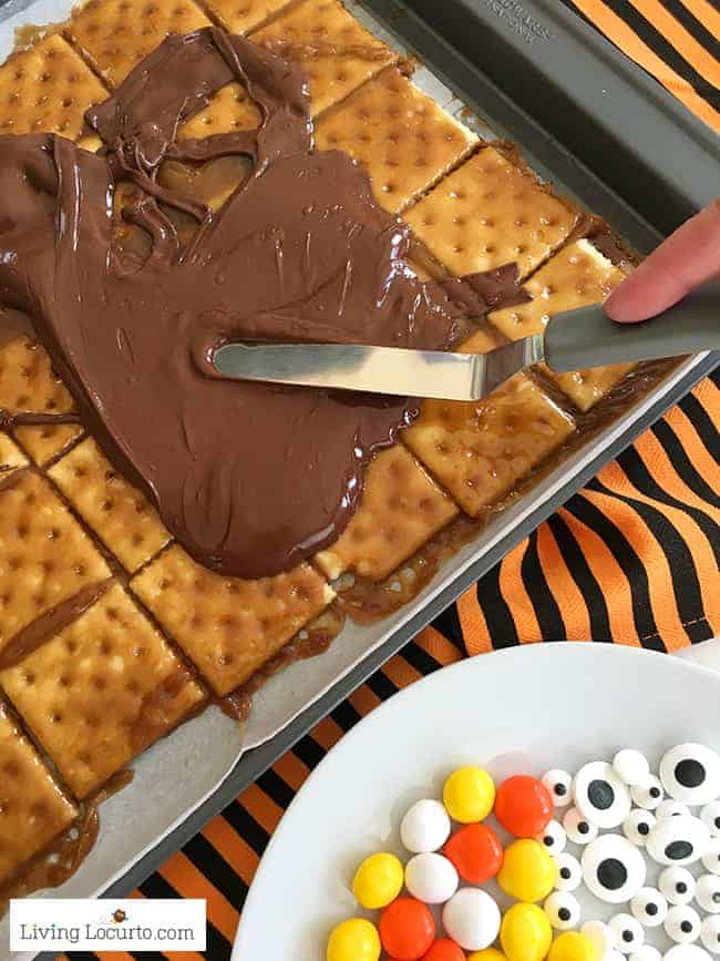 Halloween Crack saltine toffee recipe with chocolate, candy eyes and Halloween candy. Halloween Crack saltine toffee recipe with chocolate, candy eyes and Halloween candy.