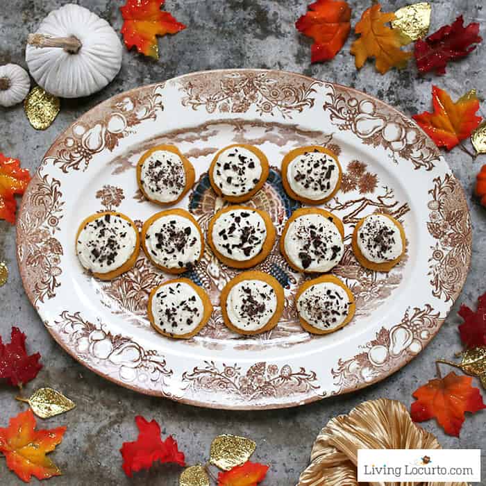 Pumpkin cookies! Easy cake mix cookies recipe with buttercream frosting and dark chocolate. Perfect pumpkin spice dessert for fall.