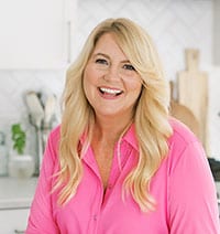 Amy Locurto Lifestyle Food Blogger smiling wearing pink shirt
