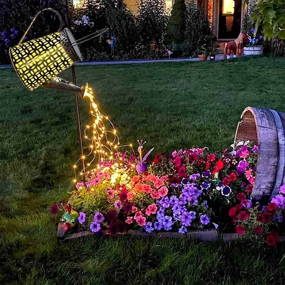 solar watering can yard art