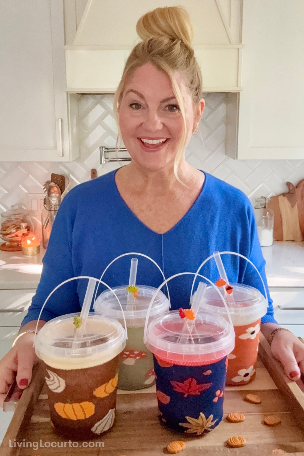 Apple Cider Punch Buckets 2 Woman holding Apple Cider Punch Buckets on a tray for a fall party.