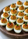 Easy pumpkin deviled eggs recipe with a natural orange filling—perfect for Halloween, Thanksgiving, or fall parties. Fun, festive, and delicious!