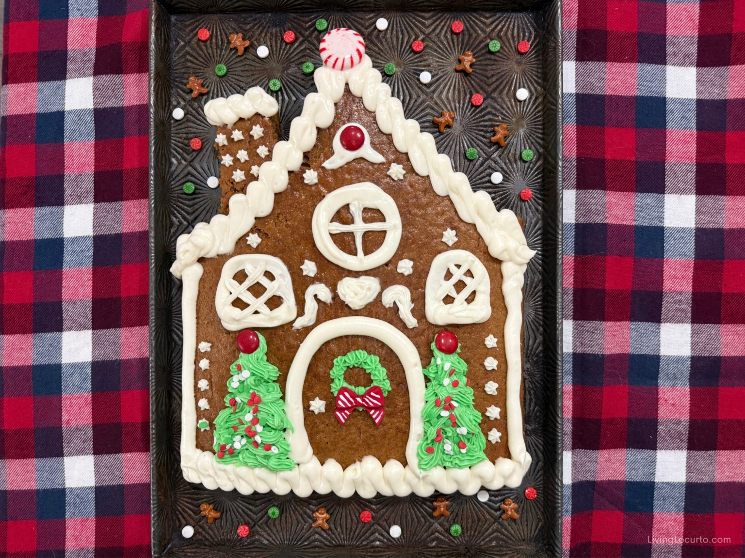 Easy Gingerbread House Cake 4 The cutest Gingerbread House Cake with a simple boxed-mix upgrade! This sweet and festive cake is shaped like a gingerbread house and decorated with easy frosting details.