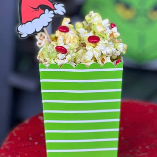 An easy no-bake holiday snack made with popcorn, green candy melts, and red candies. Perfect for Grinch-themed Christmas parties and festive movie nights.