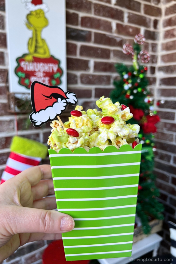 An easy no-bake holiday snack made with popcorn, green candy melts, and red candies. Perfect for Grinch-themed Christmas parties and festive movie nights.