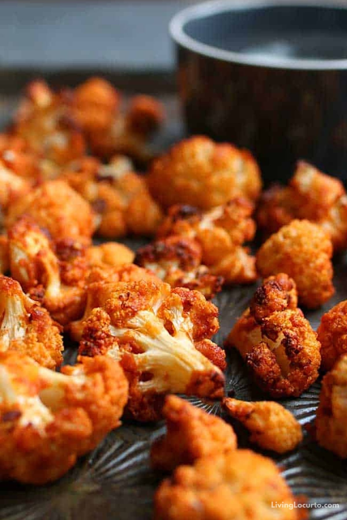 Easy low-carb Buffalo Roasted Cauliflower that turns out perfectly crispy in an air fryer or oven. Simple buffalo cauliflower bites are an easy snack recipe.