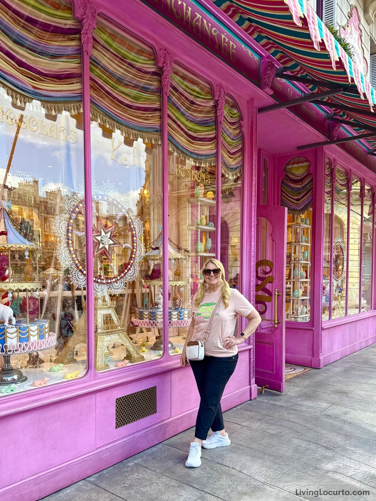 Woman in front of colorful candy store.