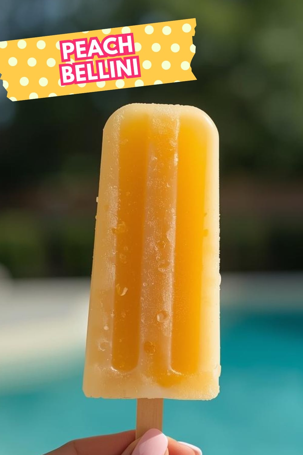 6 Easy Boozy Popsicles Recipes 7 Yellow Popsicle with a pool in the background