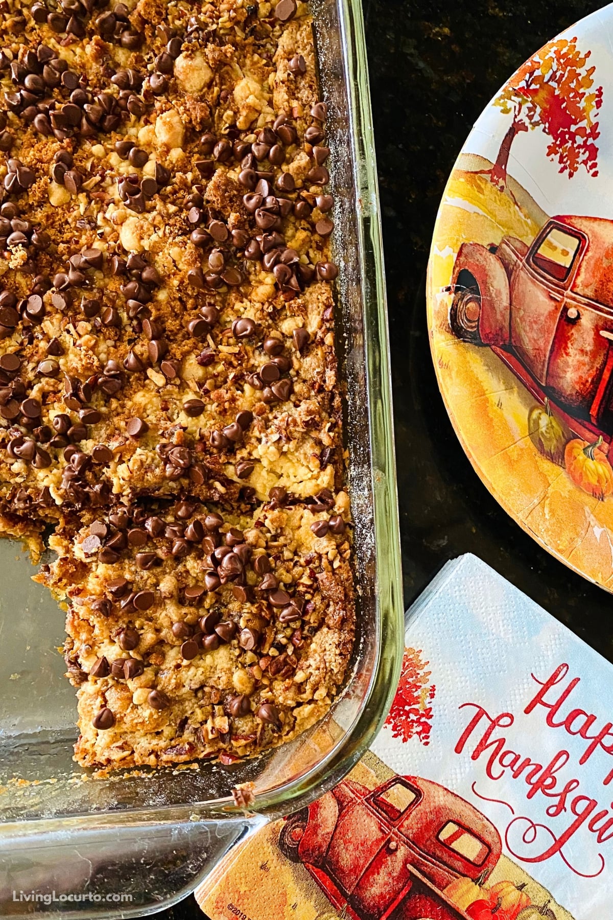 Pumpkin Dump Cake with Chocolate 4 Pumpkin Dump Cake topped with chocolate chips and a rich caramel drizzle.